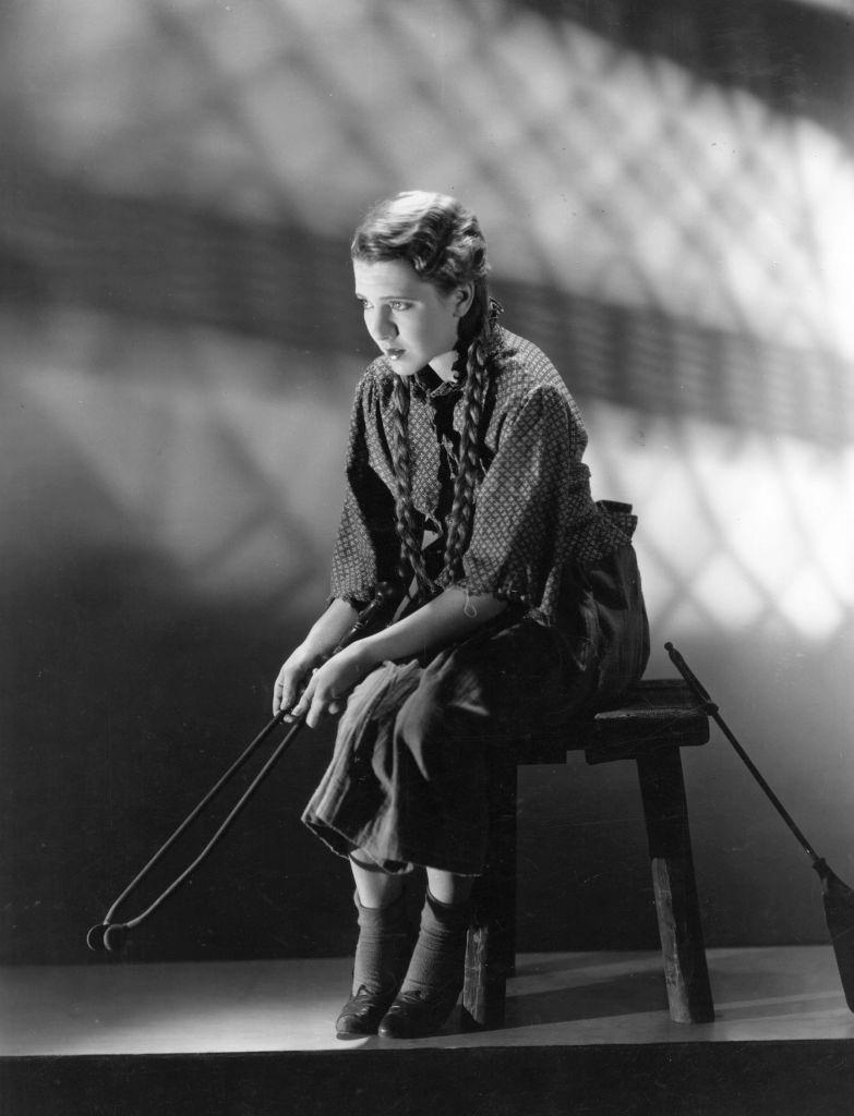 #47 Jean Arthur sitting looking forlorn as the ‘twelve o’clock girl’, Cinderella, 1925.