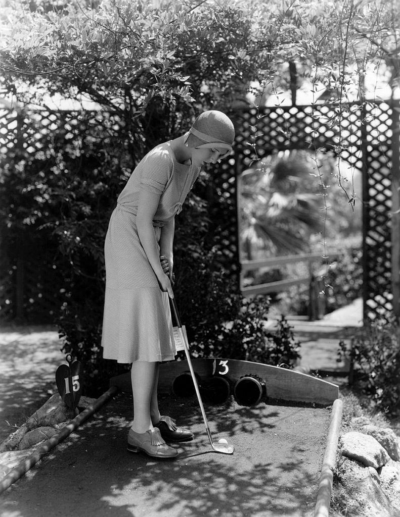 #52 Jean Arthur indulges in a round of miniature golf, 1930.
