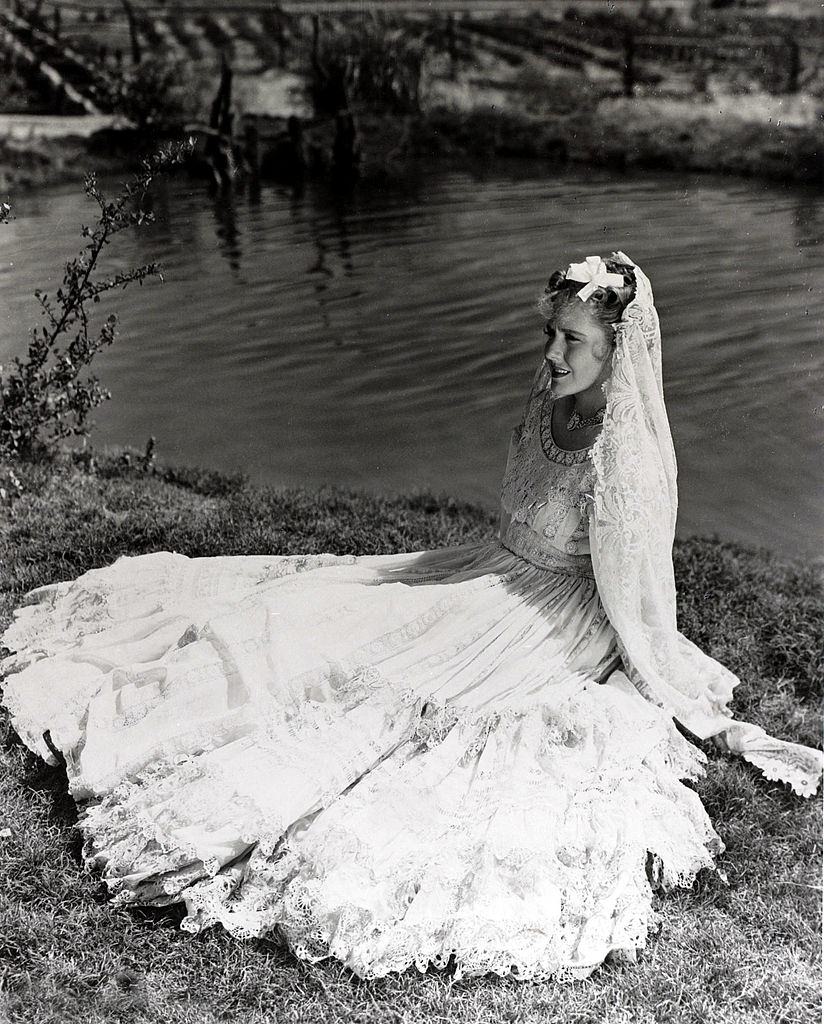 #54 Jean Arthur wearing a flowing dress and veil, 1930.