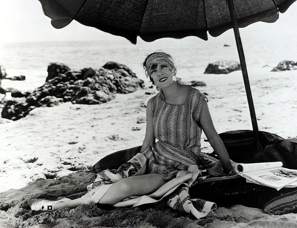#8 Jean Arthur relaxing on the beach, 1930.