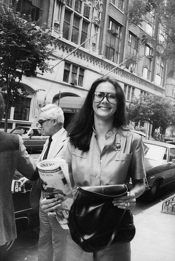#2 Lynda Carter walking on the street with The Daily News, 1970.