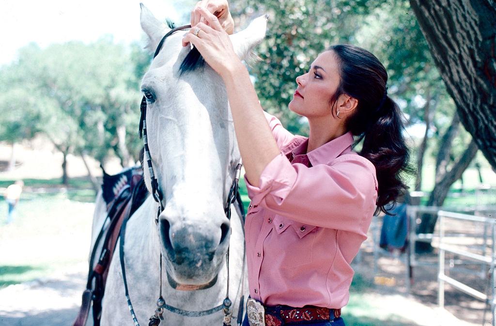 #58 Lynda Carter with a horse, 1981.