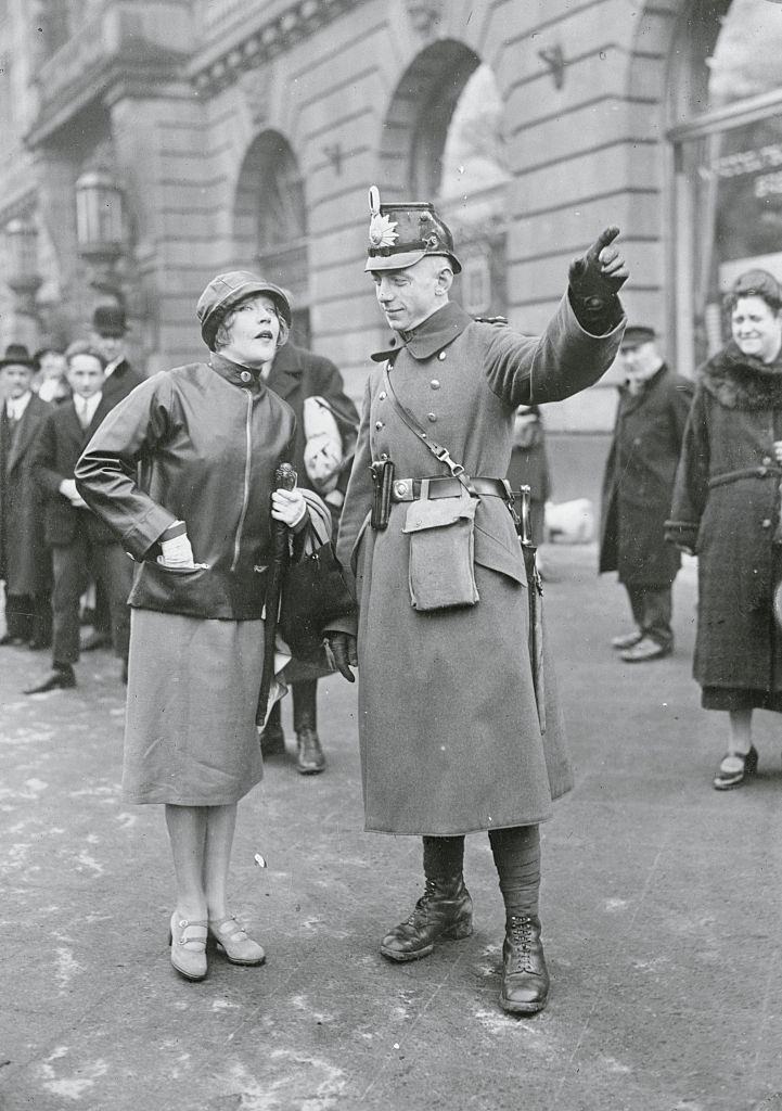#41 Mae Murray Being Directed by Policeman, 1926.