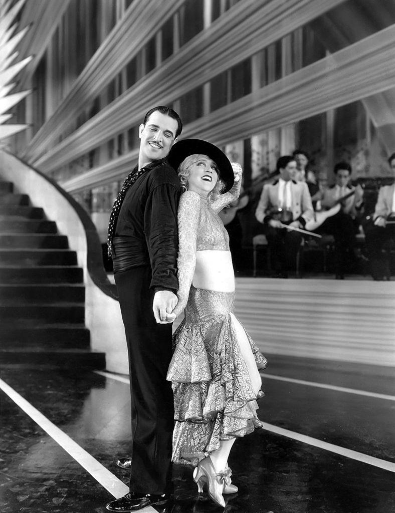 #43 Mae Murray and George Barraud in a scene from the movie ‘Peacock Alley’, 1926.