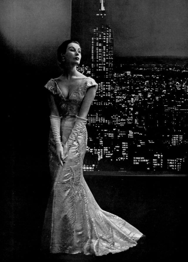 #15 Myrtle Crawford in embroidered tulle gown with pointed v in front and back by Christian Dior, 1953