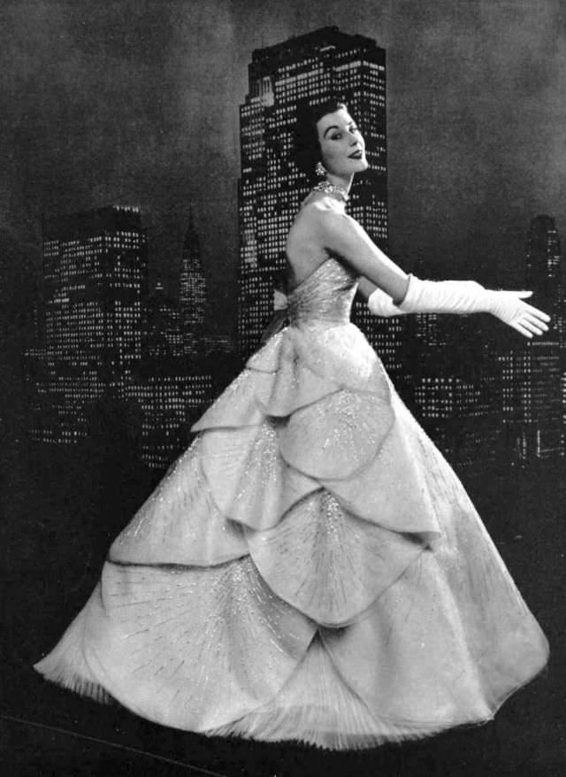 #29 Myrtle Crawford in white organza evening gown entirely embroidered with silver sequins, 1953.