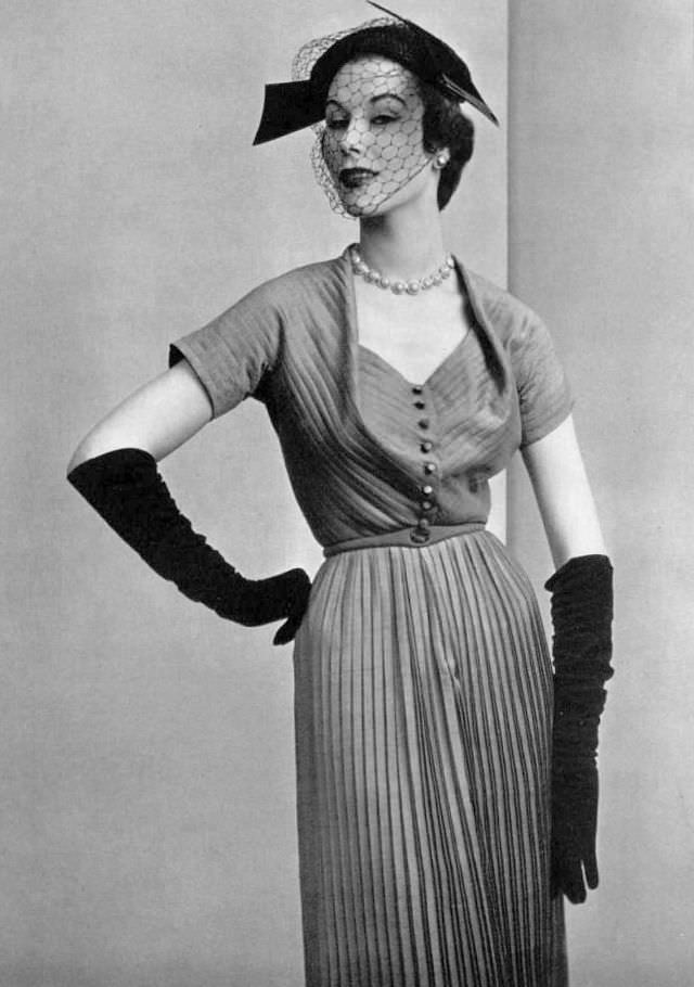 #8 Myrtle Crawford in silk afternoon dress delicately pleated throughout with finely draped neckline by Manguin, 1952