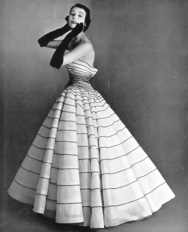 #9 Myrtle Crawford in white tulle evening gown applied entirely with thin bands of black velvet, by Manguin, 1952