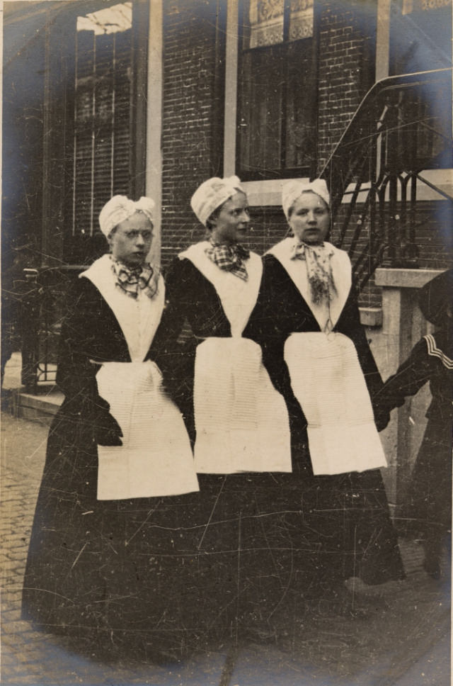 #7 Here, more tall windows, traditional costume and curious glances.