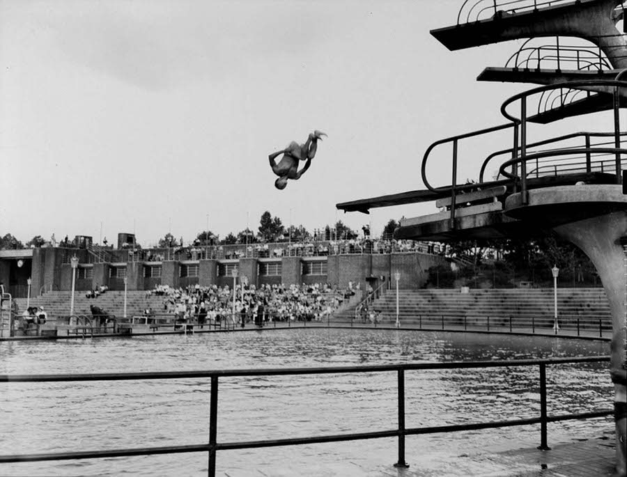 #18 A young man is pictured above on August 17, 1943, completing an incredible dive during a competition at Astoria pool, which still exists today.