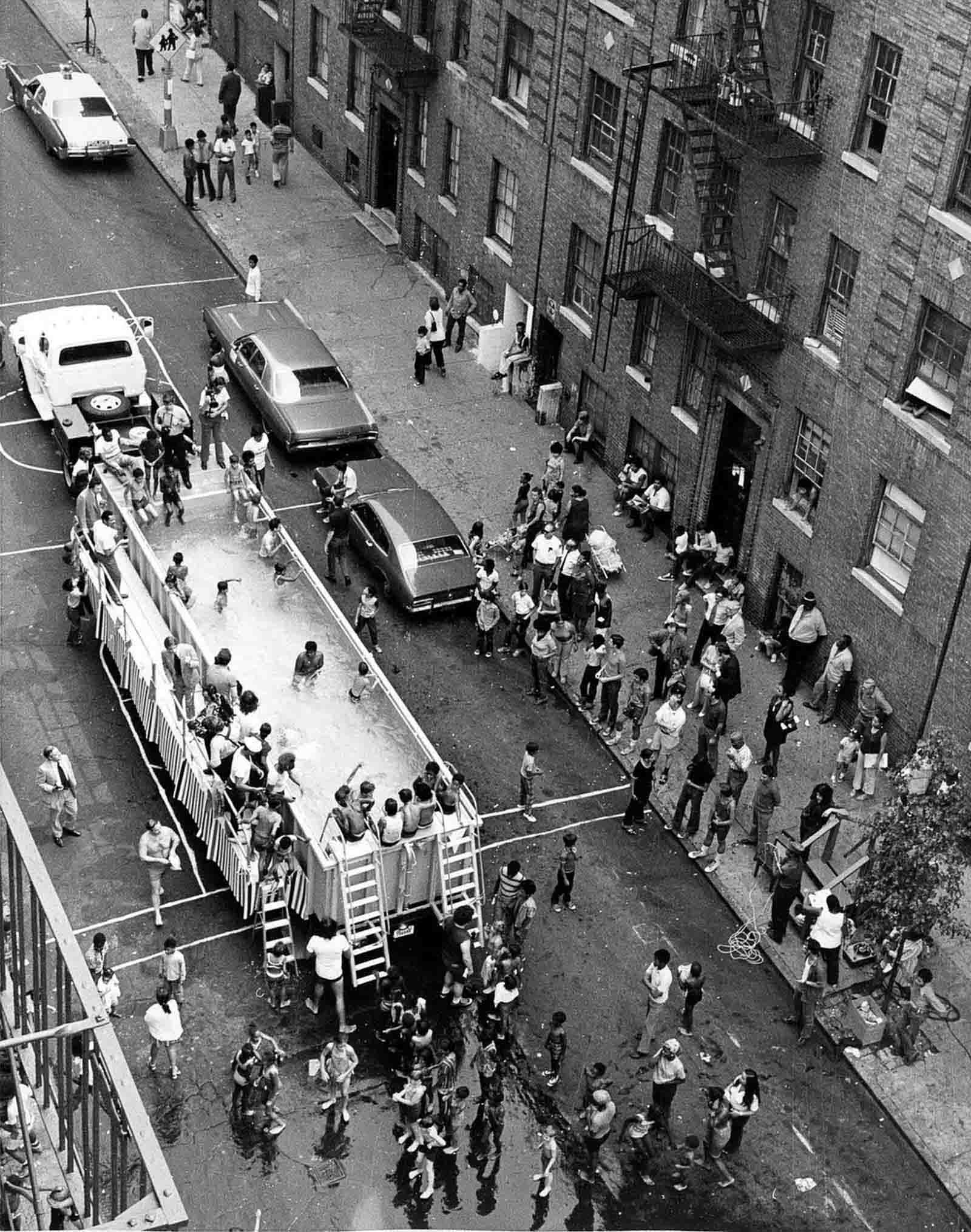 #6 Dozens of children and adults crowded in and around what was called a ‘swimmobile’ in the late 1960s.