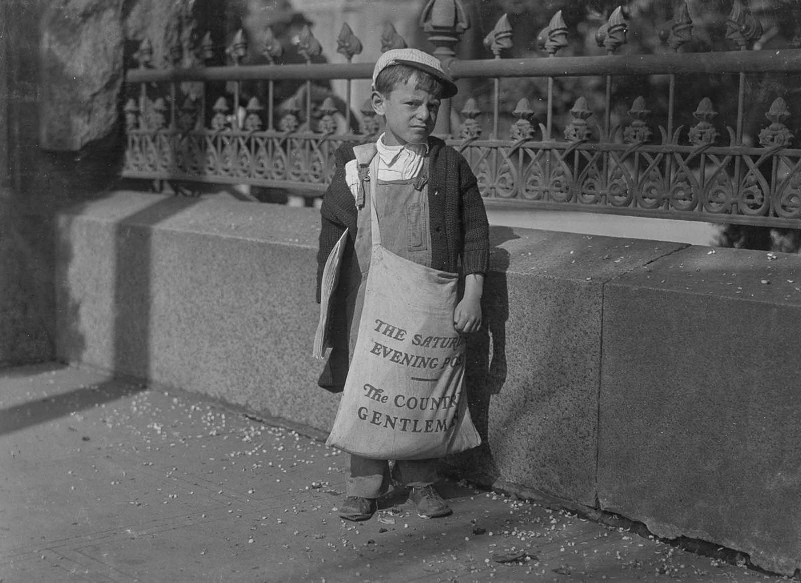 #10 Freddie Kafer, a very immature little newsie selling Saturday Evening Posts and newspapers at the entrance to the State Capitol.