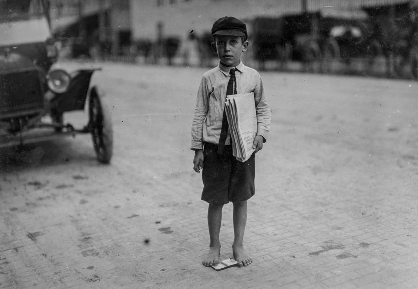 #24 Eight-year-old newsie. Many youngsters get up early to sell papers. One 10-year-old starts out at 3 a.m. every day and goes to school. Waco, Texas, 1913.