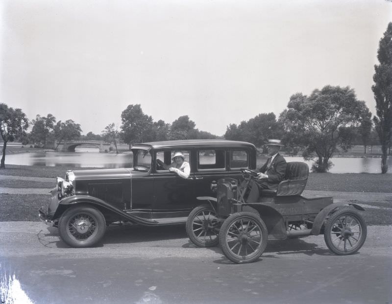 #233 “Then and now” photo of two Oldsmobile cars. The vintage 1897 model Oldsmobile is parked next to a new 1931 Oldsmobile. June 1931