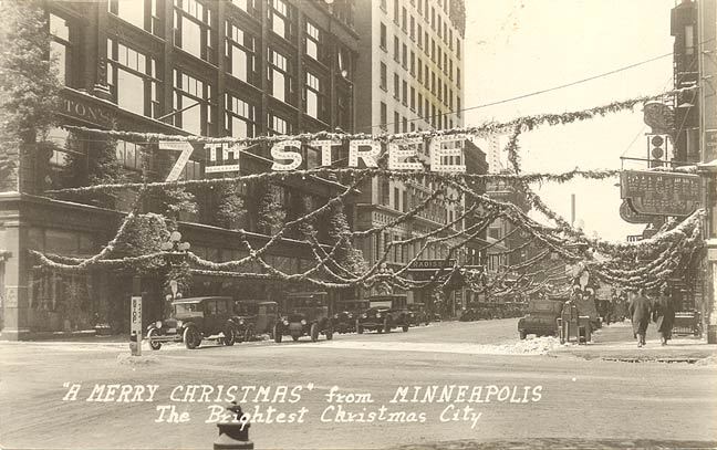 #19 Christmas decorations at 7th Street and Nicollet Avenue. Dayton department store on left, 1930s