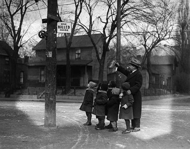 #32 Minneapolis Mayor George E. Leach points out a good place to get run down by a car, Minneapolis, Minnesota, 1930s