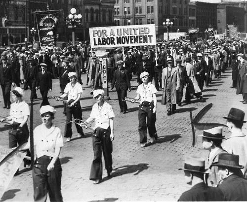 #41 Workers marching through Minneapolis Loop in observance of May Day chanting, 1937