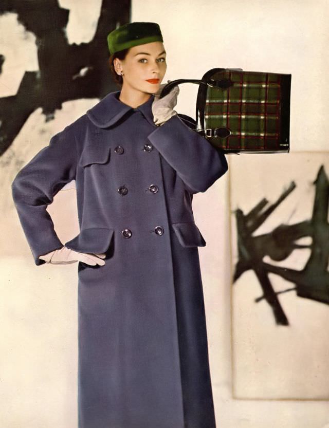 #20 Anne Gunning in blue fleece coat, double breasted and flapped pockets by Harry Frechtel, bag by Josef, hat by Gardner, photo by Louise Dahl-Wolfe, paintings by Franz Kline, Harper’s Bazaar, 1954