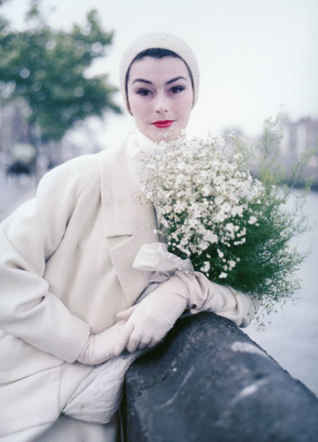 #3 Anne Gunning in ‘Bainin’ tweed coat with large lapels and pockets by Sybil Connolly, photo by Milton Greene on Wellington Quay in Dublin, Ireland, 1953