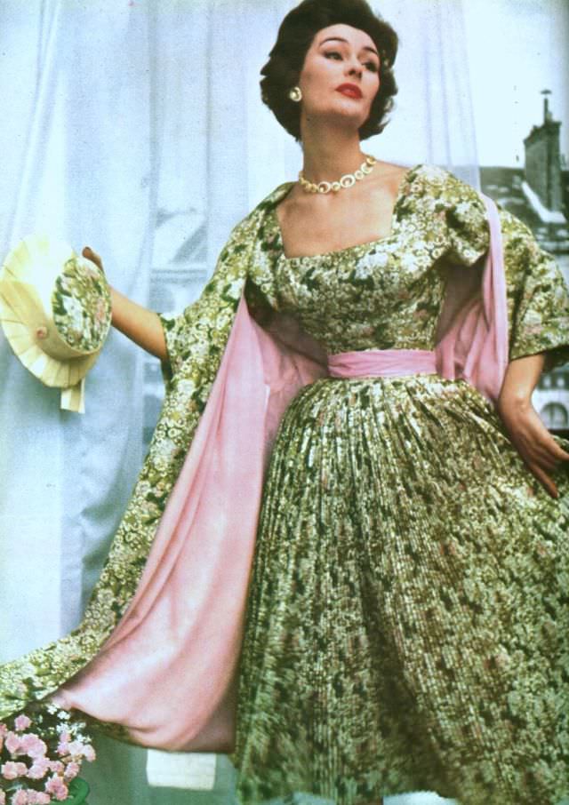 #7 Anne Gunning in finely pleated floral print dress with matching coat lined in pink satin by Christian Dior, Paris Vogue, 1953