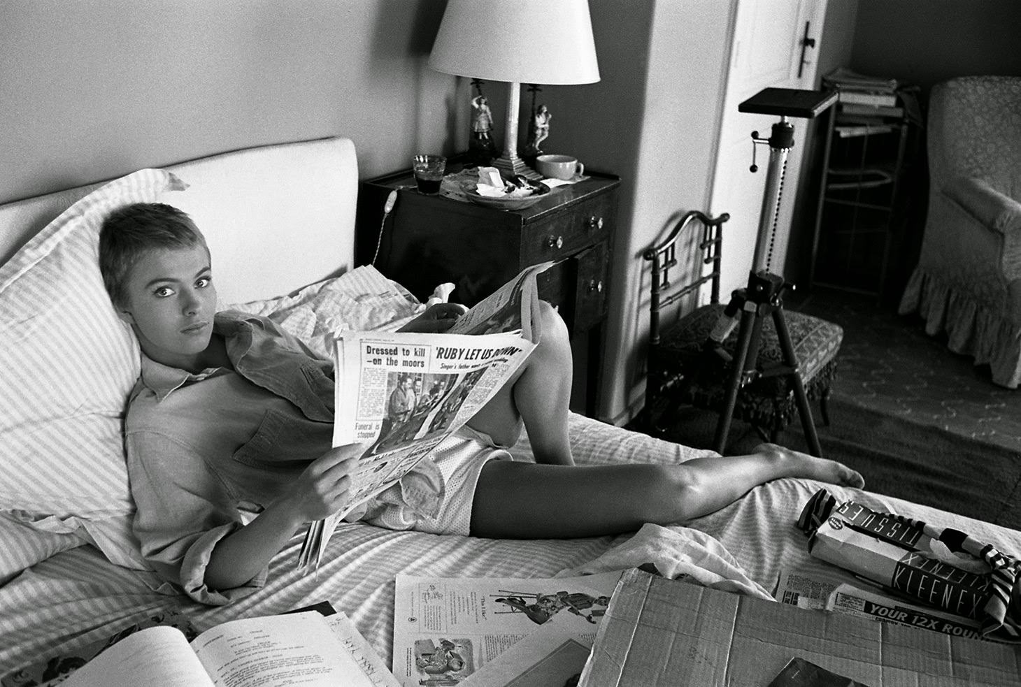 #35 Jean Seberg reads the paper in bed during filming of “Bonjour Tristesse” in France, 1957
