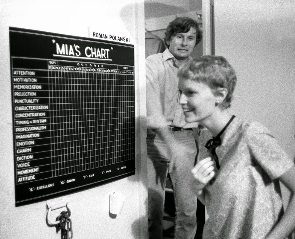 #46 Roman Polanski with Mia Farrow as she discovers her chart on the Paramount set of “Rosemary’s Baby,” 1967