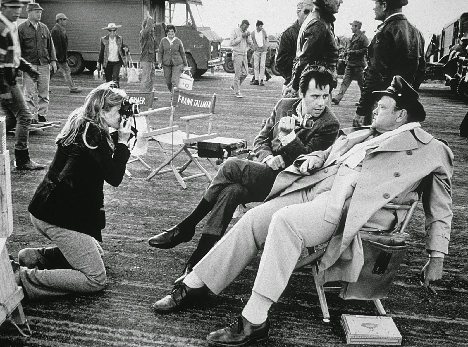 #6 Candice Bergen visits the “Catch-22” set in Mexico, photographing Peter Bogdanovich as he interviews cast member Orson Wells; 1969