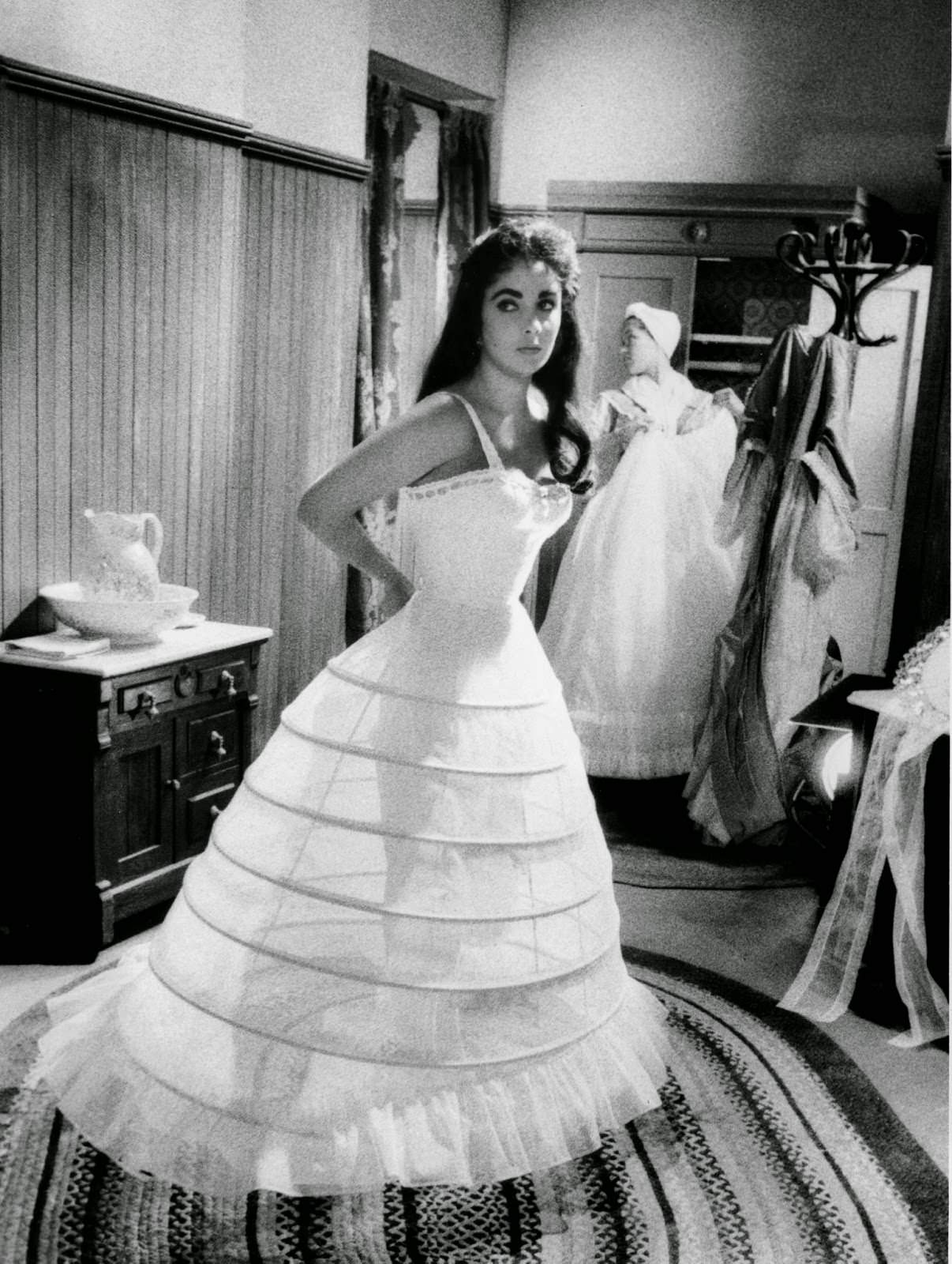 #8 Elizabeth Taylor dresses for a scene on MGM’s “Raintree County,” 1956