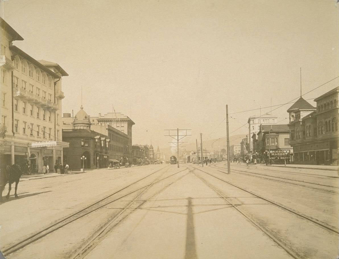 #78 Street scene, with horse buggies, electric trolley car, 1922.
