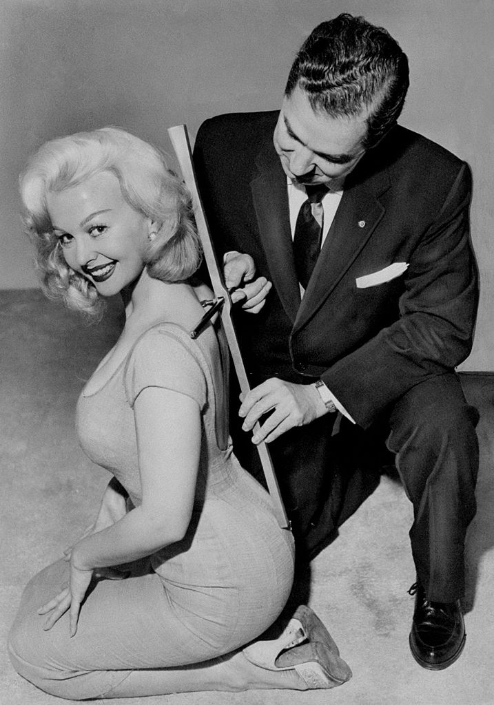 #47 Greta Thyssen being measured with distortion analyzer by Dr. Vincent J. O’Neill, President of Chiropractic Association of New York State.