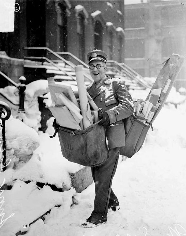 #21 Mailman poses with his heavy load of christmas mail and parcels, chicago, 1929