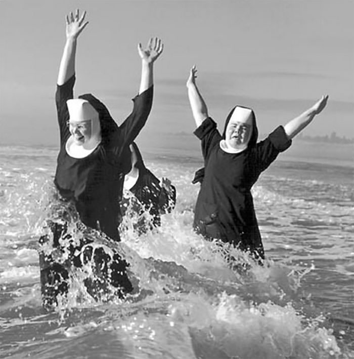 #42 Nuns from the order of st. benedict make a splash in the pacific ocean while vacationing at grayland, 1960