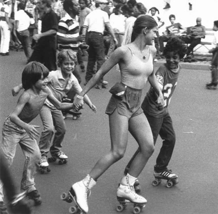 #53 Roller girl skating with kids, 1970s