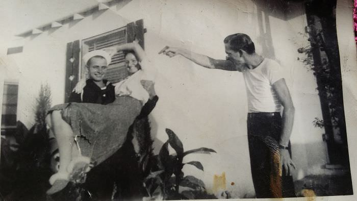 #57 Man returns home from time in the navy. carrying sister while brother in law shoots them with a water pistol