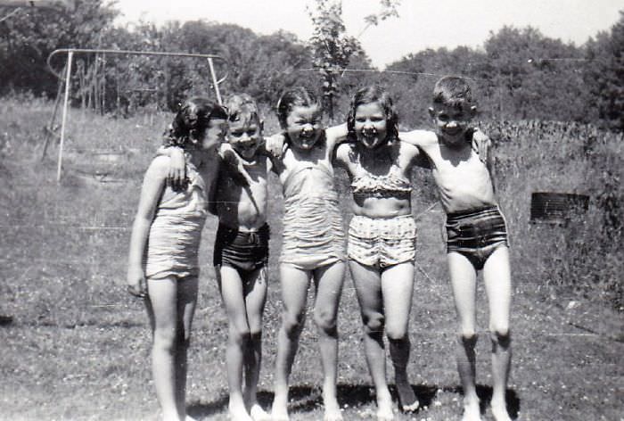 #75 Summer fun in the sprinkler ..about 1950
