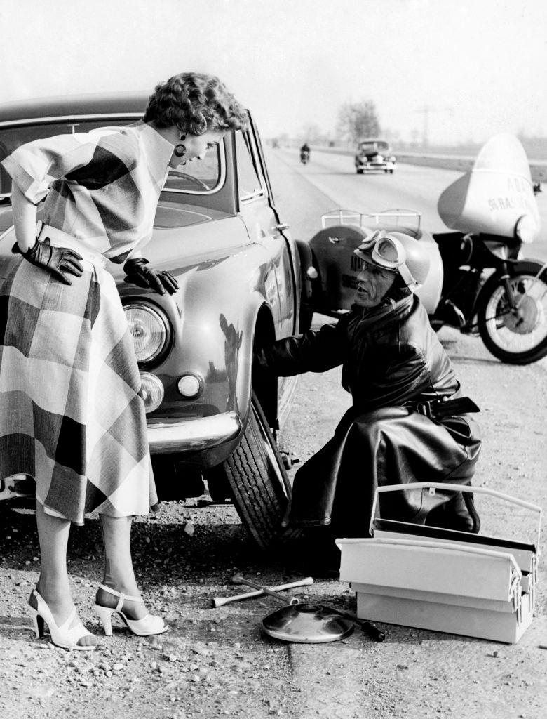 #60 Woman with car trouble, 1960.