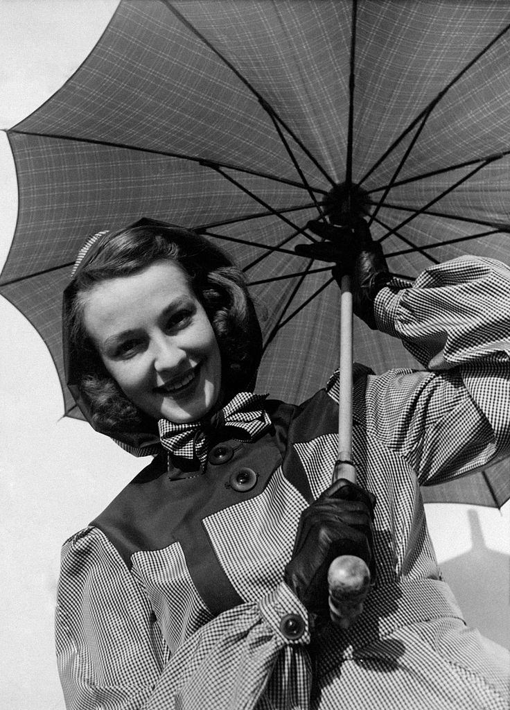#80 A model showing an umbrella, 1960s.