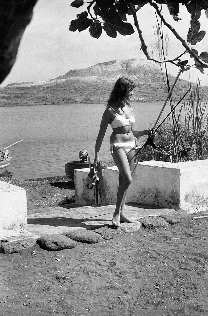#81 German tourist wearing a bikini in Vulcano Island, 1960.