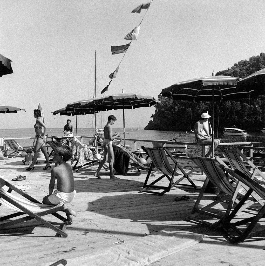 #90 Bathers relaxing at the exclusive lido Paraggi on the riviera of Liguria, 1960s.