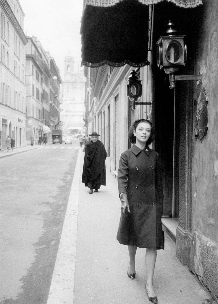 #91 A young woman walking in via Condotti, 1960s.