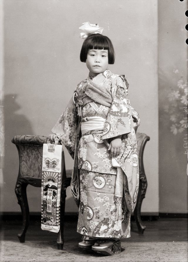 #12 A Japanese girl in a kimono and wooden sandals