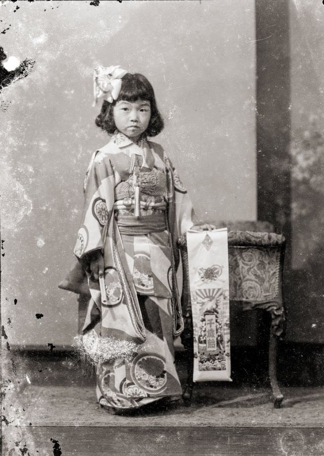 #27 A young Japanese girl in kimono with traditional Shichi-Go-San candy (Chitose Ame)