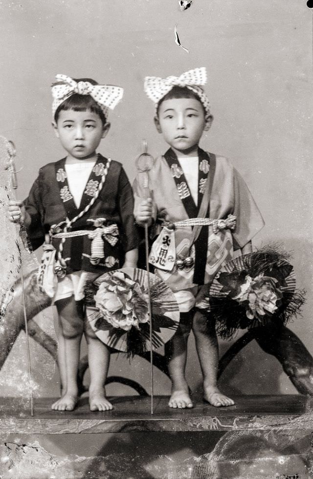 #30 Two Japanese boys in traditional happi coats and headbands (with bows)