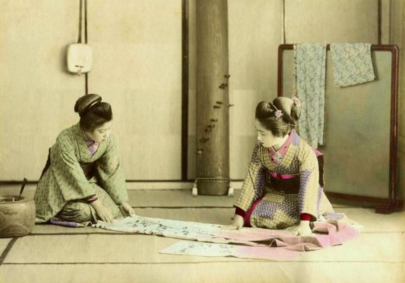 #14 Geishas folding a kimono in old Japan