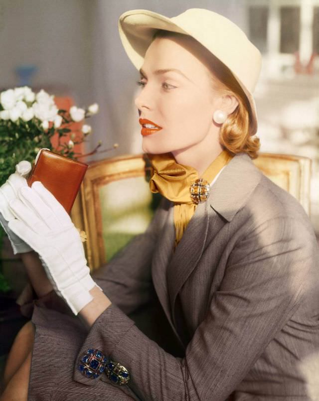 #24 Lillian Marcuson wearing a hairline worsted suit, by Ben Frances Denney, jewelry on the cuff and scarf by Marcel Boucher, 1952