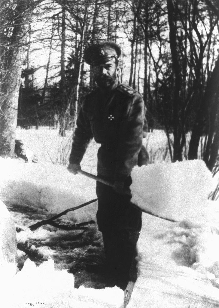 #45 Czar Nicholas II of Russia shovels snow in the park at Tsarskoe Selo, Russina, where he and the royal family were interned in 1917.