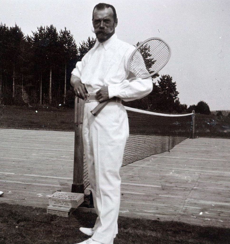 #52 Nicholas II with a tennis racket.