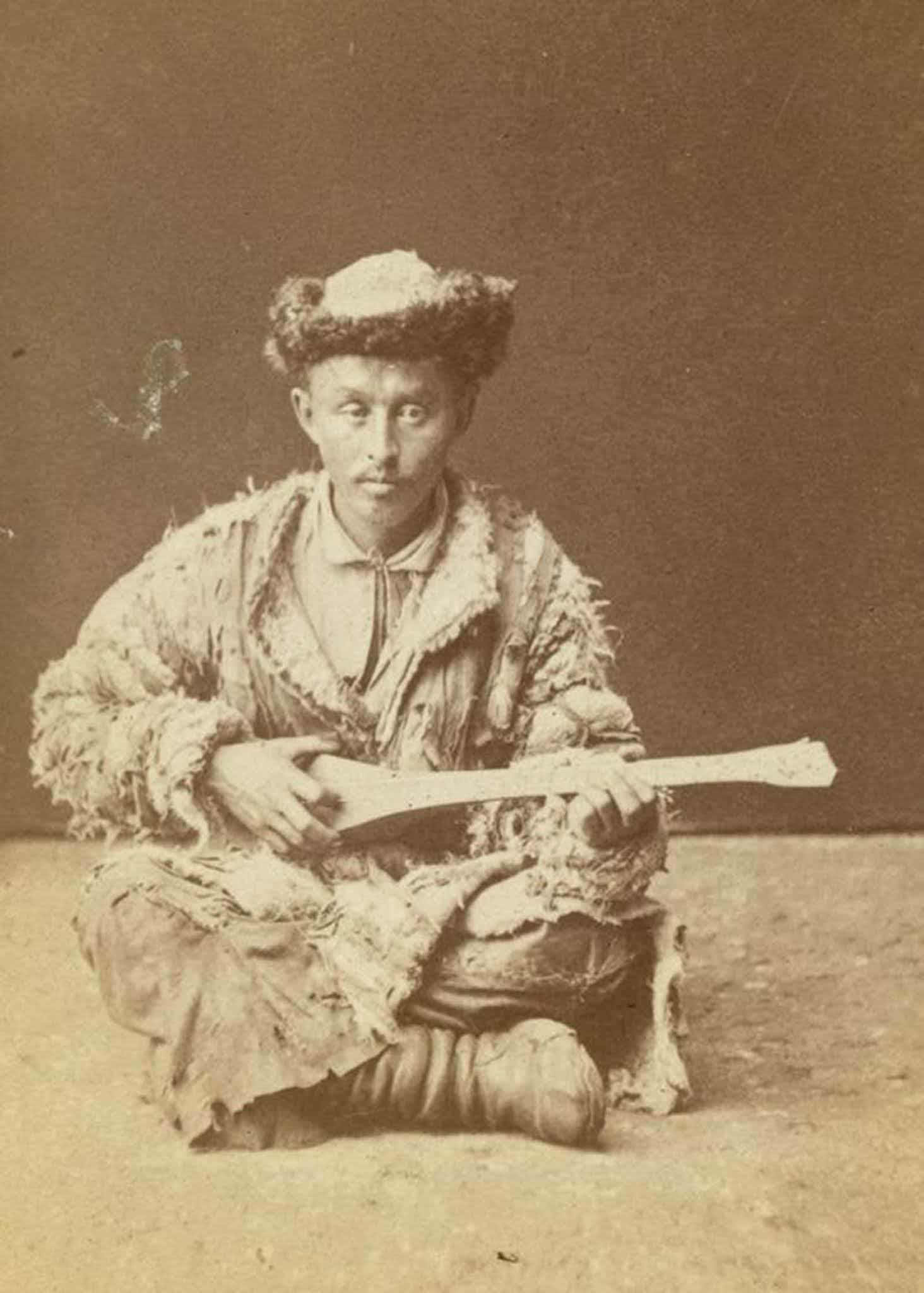 #11 A Kazakh musician playing a dombra.