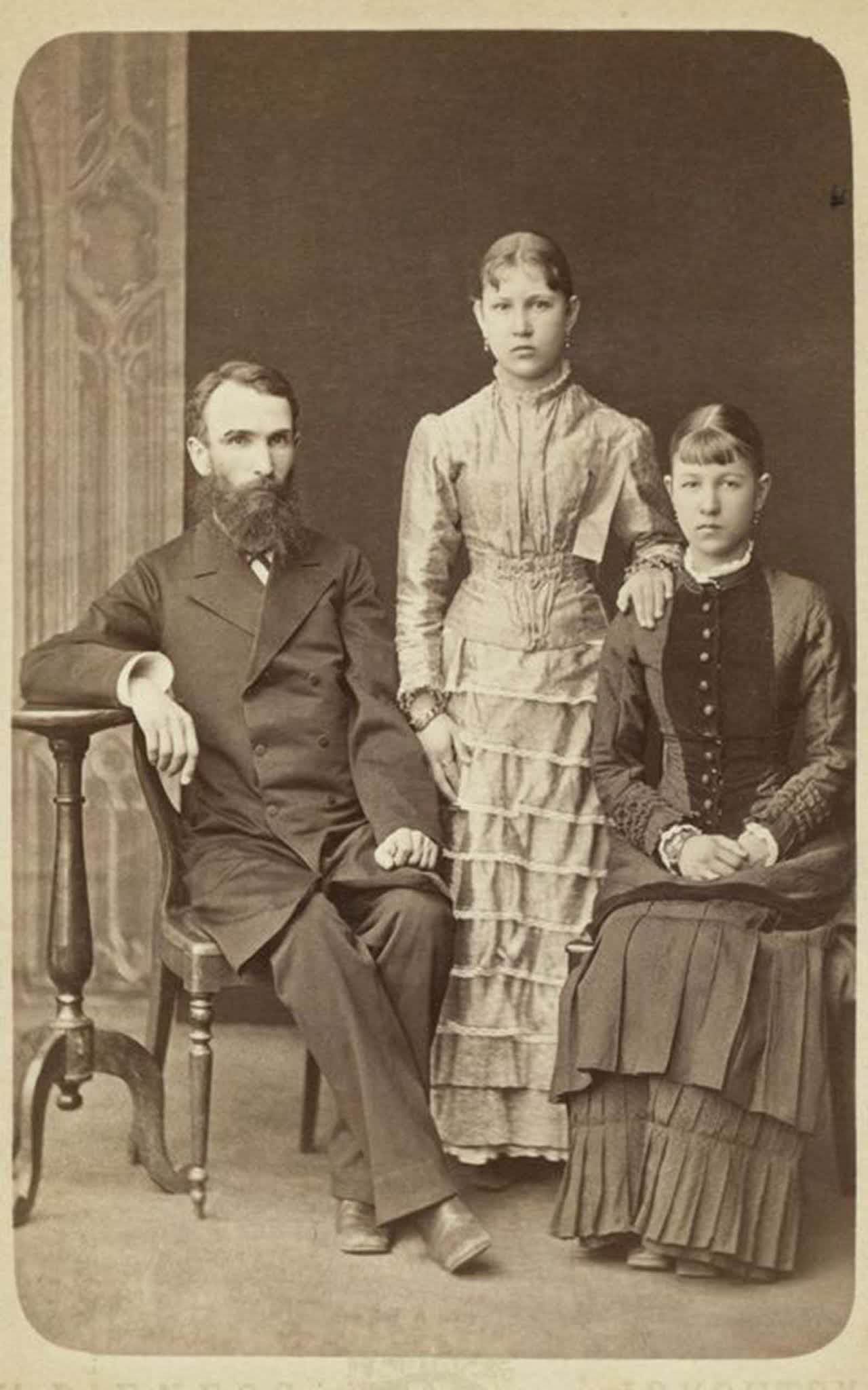 #23 A man and his daughters.