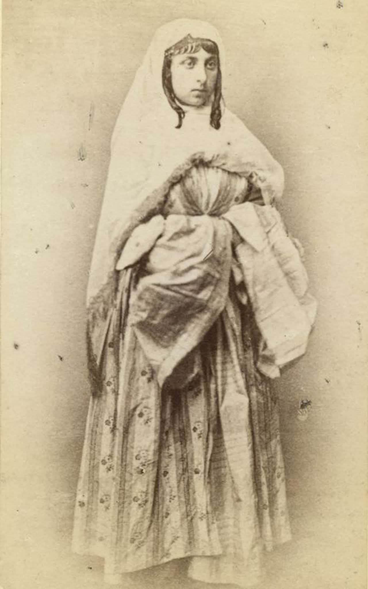 #26 A woman in traditional dress.